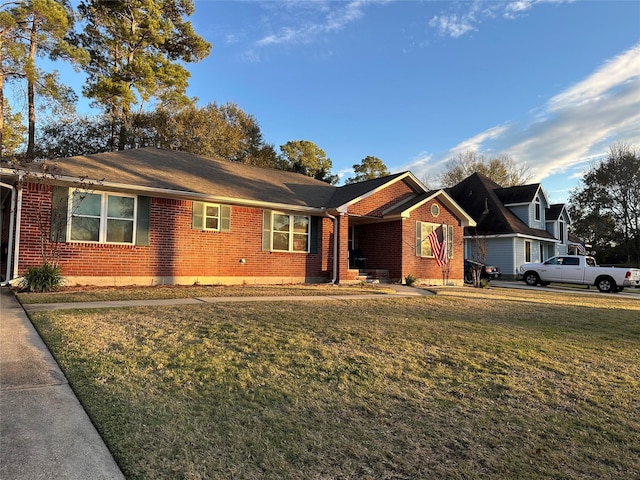 single story home with a front yard