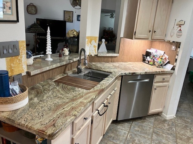 kitchen with ceiling fan, stainless steel dishwasher, kitchen peninsula, sink, and light brown cabinets