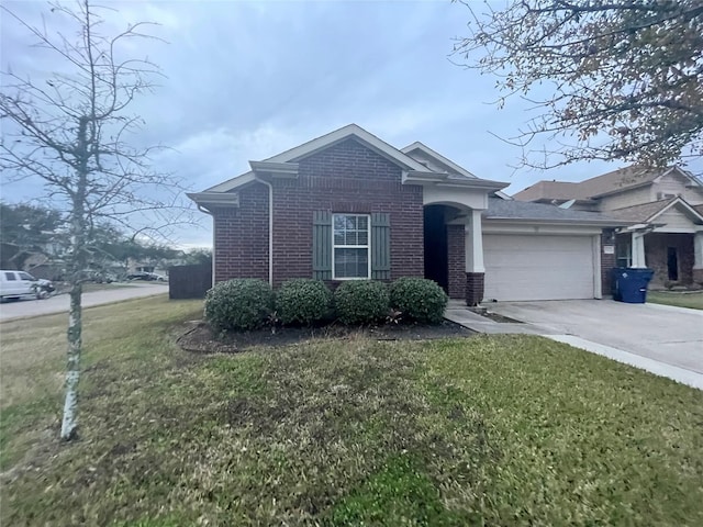 view of front of property with a front lawn and a garage