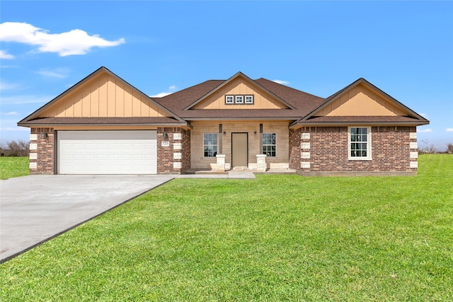 view of front of house featuring a garage and a front lawn