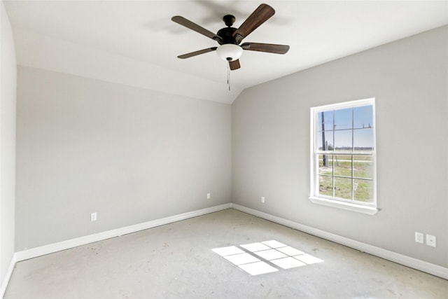 empty room featuring ceiling fan and lofted ceiling