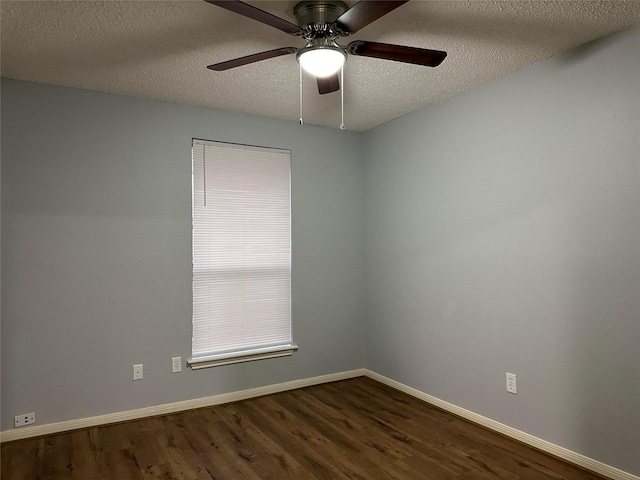 spare room featuring a textured ceiling, ceiling fan, and dark hardwood / wood-style flooring