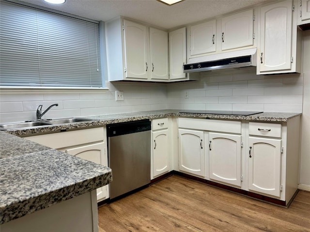 kitchen with white cabinets, decorative backsplash, sink, hardwood / wood-style flooring, and stainless steel dishwasher