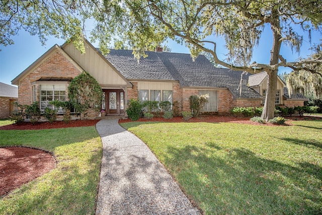 ranch-style home featuring a front yard