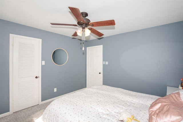 carpeted bedroom featuring ceiling fan