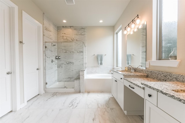 bathroom featuring vanity and plus walk in shower