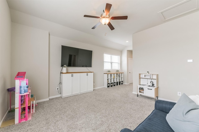 carpeted living room featuring ceiling fan and lofted ceiling