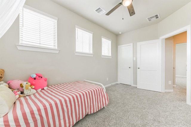 bedroom with ceiling fan and carpet