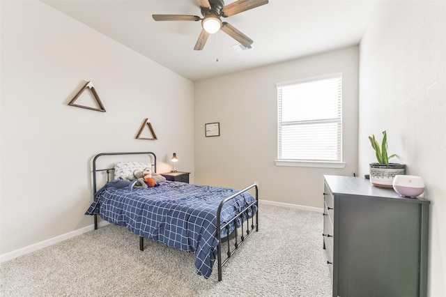 bedroom featuring ceiling fan and light colored carpet