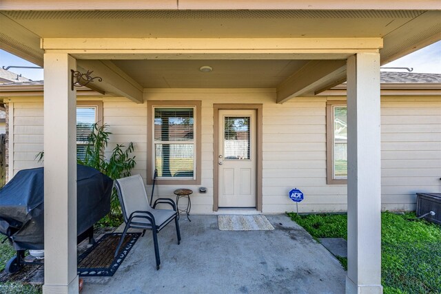 entrance to property with a patio