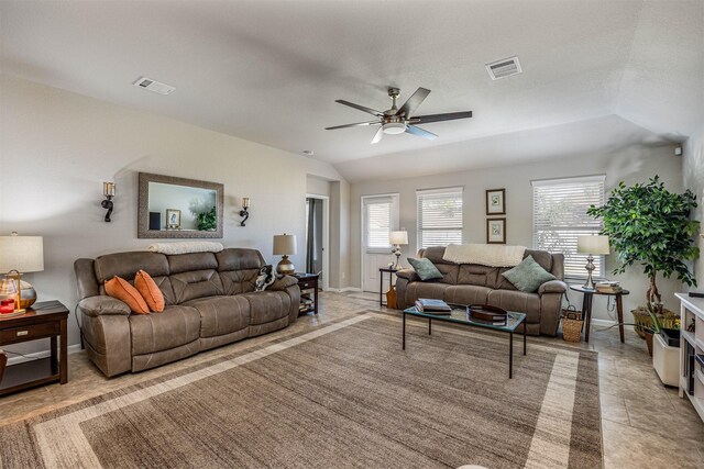 tiled living room with ceiling fan