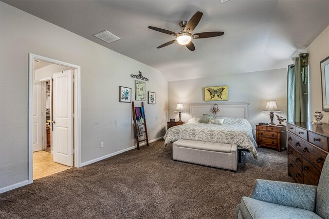 bedroom featuring ceiling fan, light colored carpet, and vaulted ceiling