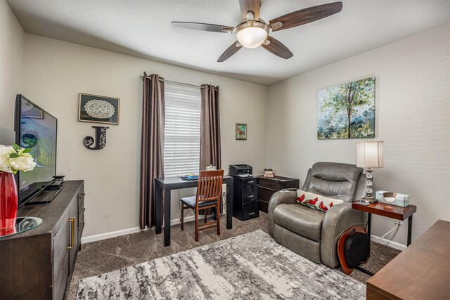 office space featuring ceiling fan and carpet