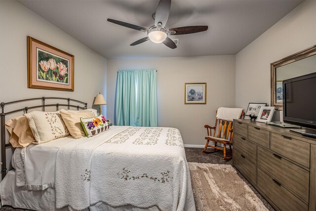 bedroom with ceiling fan and carpet