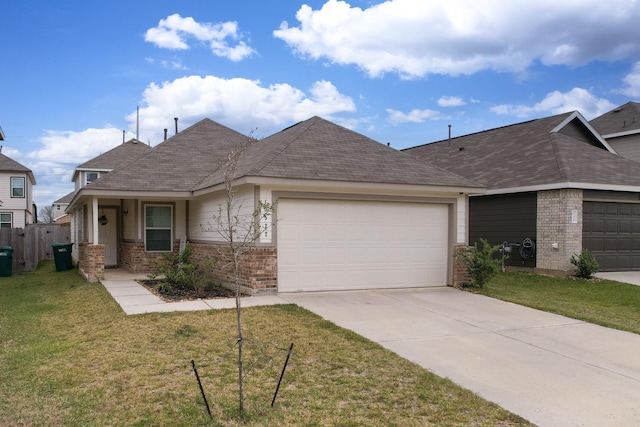 ranch-style house featuring a front yard and a garage