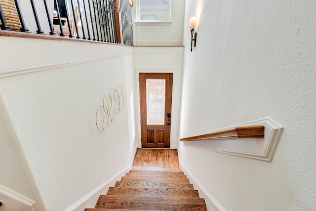 stairway featuring hardwood / wood-style floors