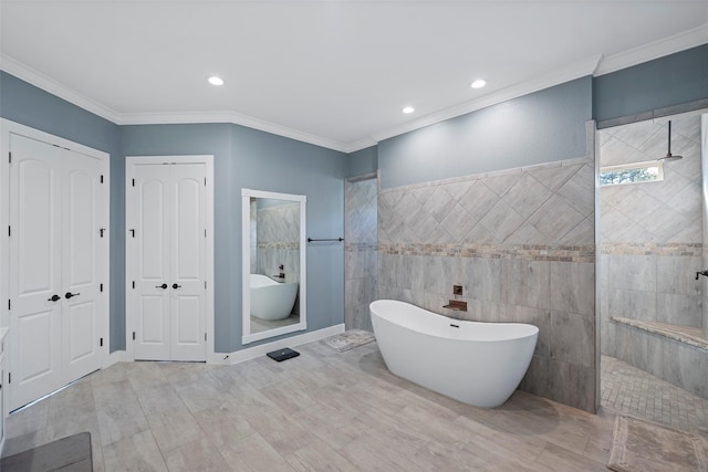 full bathroom with a walk in shower, ornamental molding, and a freestanding tub