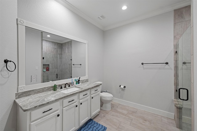 full bath featuring visible vents, vanity, baseboards, ornamental molding, and a shower stall