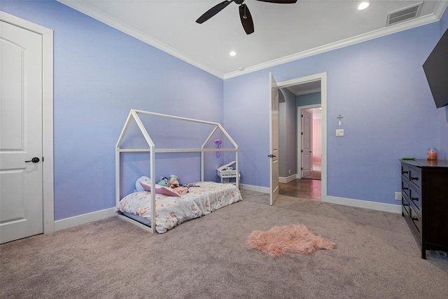 unfurnished bedroom with carpet floors, visible vents, baseboards, and crown molding