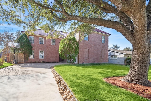 exterior space featuring a front lawn