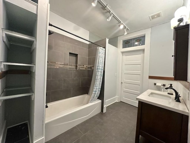 bathroom with tile patterned flooring, vanity, and shower / tub combo with curtain