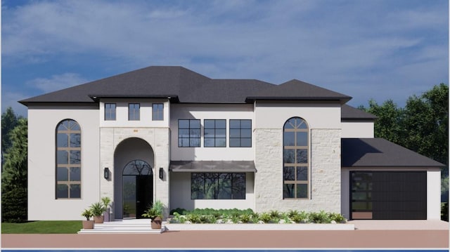 view of front of house featuring a garage, stone siding, and stucco siding