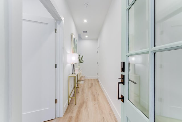 corridor featuring light hardwood / wood-style flooring