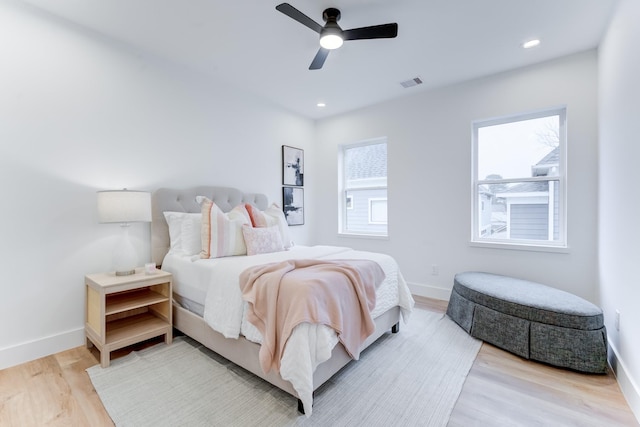 bedroom featuring light hardwood / wood-style floors and ceiling fan