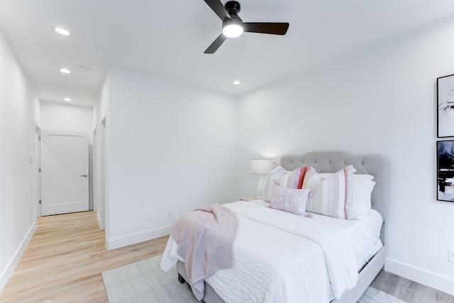 bedroom featuring light hardwood / wood-style flooring and ceiling fan