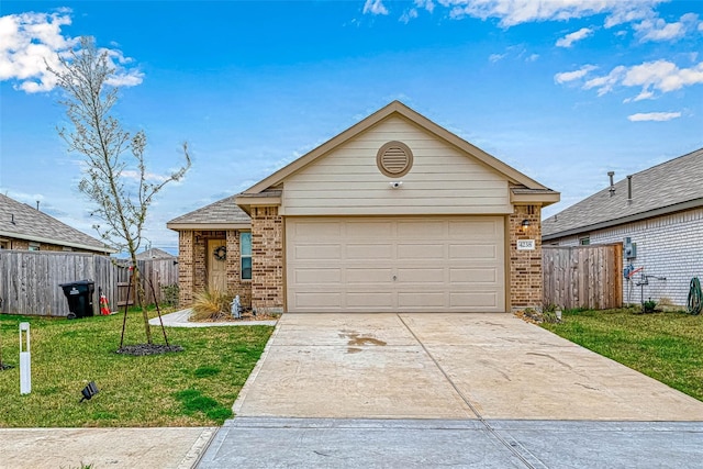 ranch-style home with a garage and a front lawn