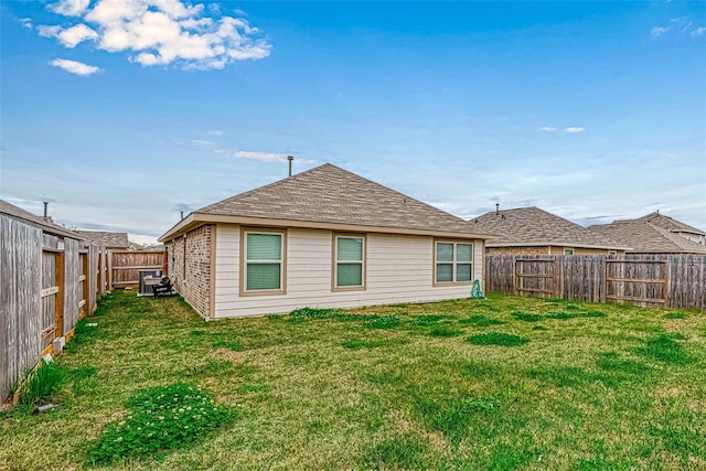 back of house featuring a yard