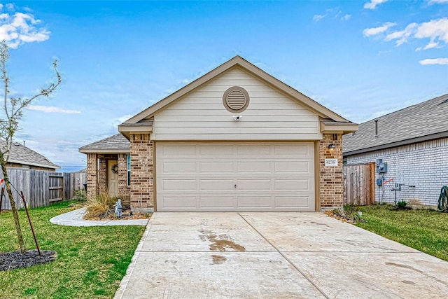 single story home featuring a garage and a front yard