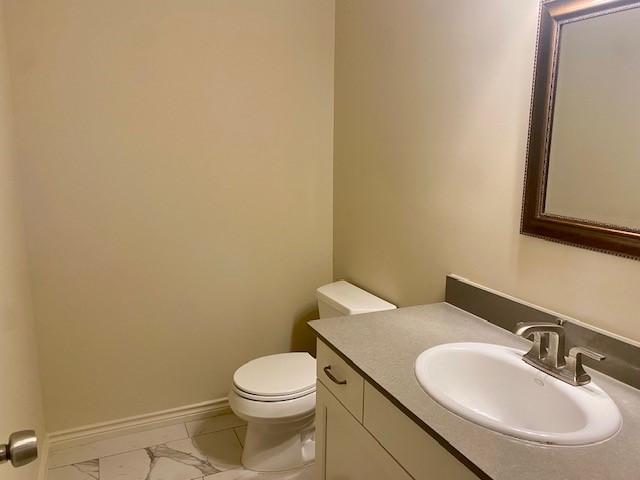 bathroom with vanity and toilet