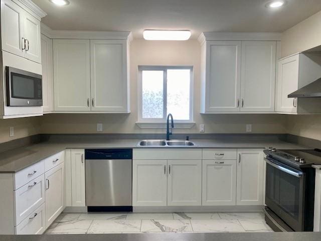 kitchen with white cabinetry, sink, and stainless steel appliances