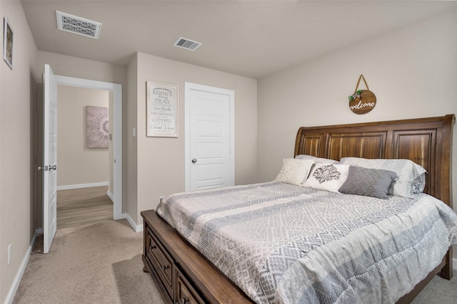 bedroom with light carpet