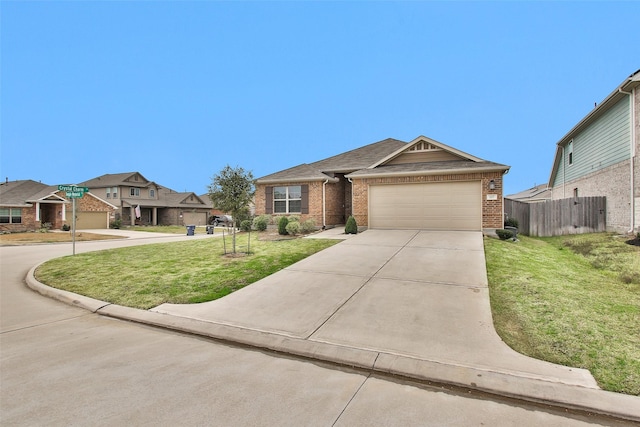 view of front of property featuring a garage and a front lawn