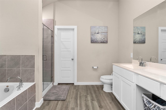 full bathroom with hardwood / wood-style floors, toilet, vanity, and plus walk in shower