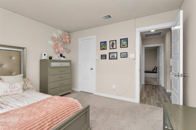 bedroom with light colored carpet