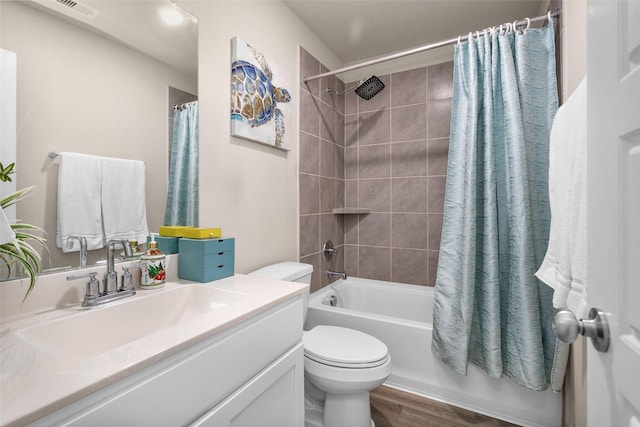 full bathroom with toilet, vanity, shower / bath combo with shower curtain, and hardwood / wood-style floors