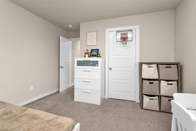 bedroom featuring light colored carpet