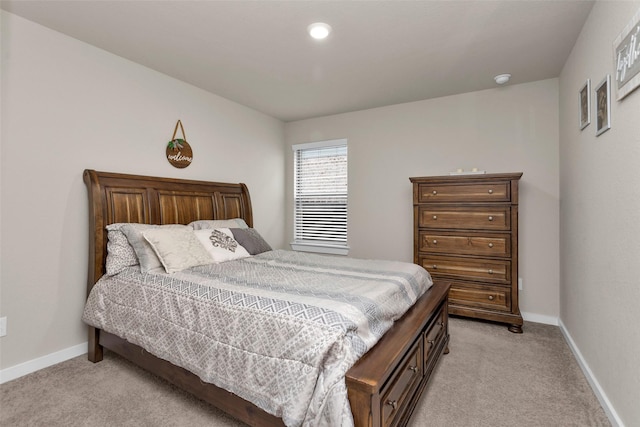 bedroom featuring light carpet