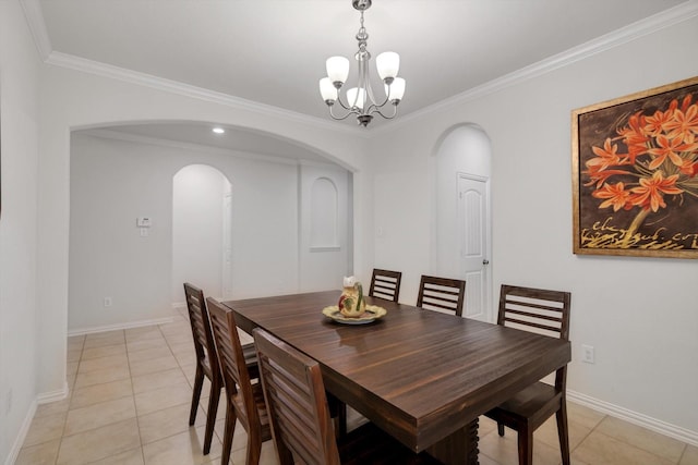 dining room with light tile patterned floors, ornamental molding, and an inviting chandelier