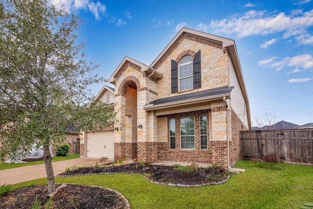 view of front of home featuring a garage and a front lawn