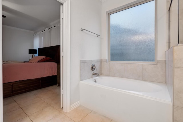 bathroom featuring a tub to relax in, tile patterned floors, and crown molding