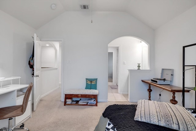 carpeted bedroom with vaulted ceiling