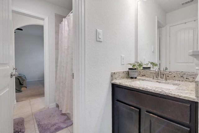 bathroom with vanity and tile patterned flooring