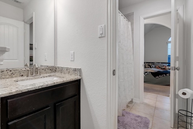 bathroom with vanity and tile patterned floors