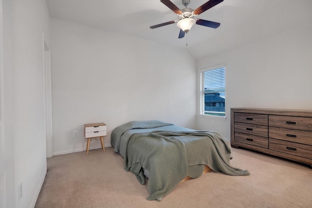 carpeted bedroom featuring vaulted ceiling and ceiling fan