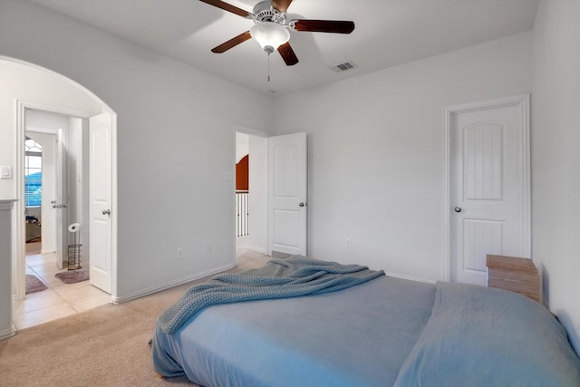 bedroom with ceiling fan and light colored carpet