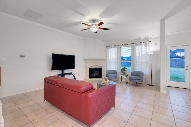 tiled living room featuring ceiling fan and ornamental molding